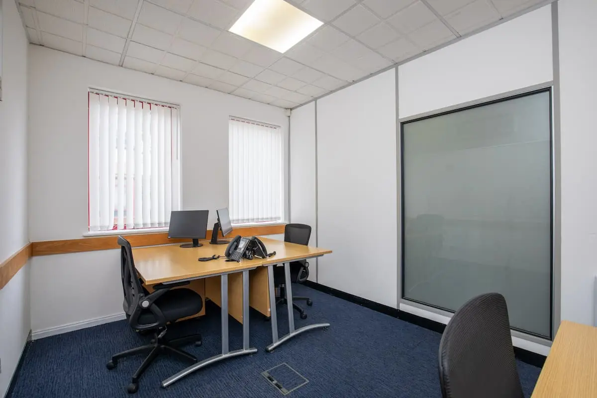 Workspace detail in three person office at Alexandra Gate Cardiff